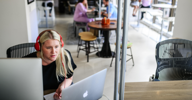 Person working on laptop in office setting