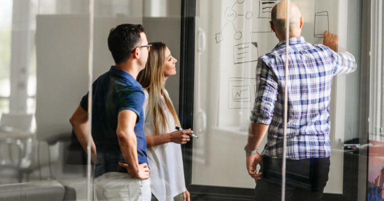 People working together at a whiteboard