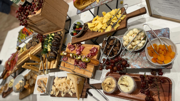 photograph of cheeses with fruits and meats