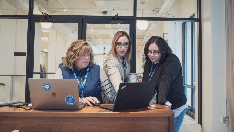 Insurance leaders and UX designers working on accessibility components