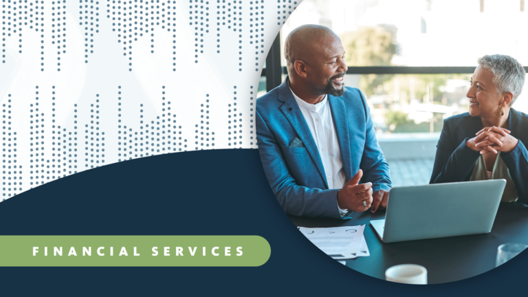 Two financial services colleagues working at a laptop